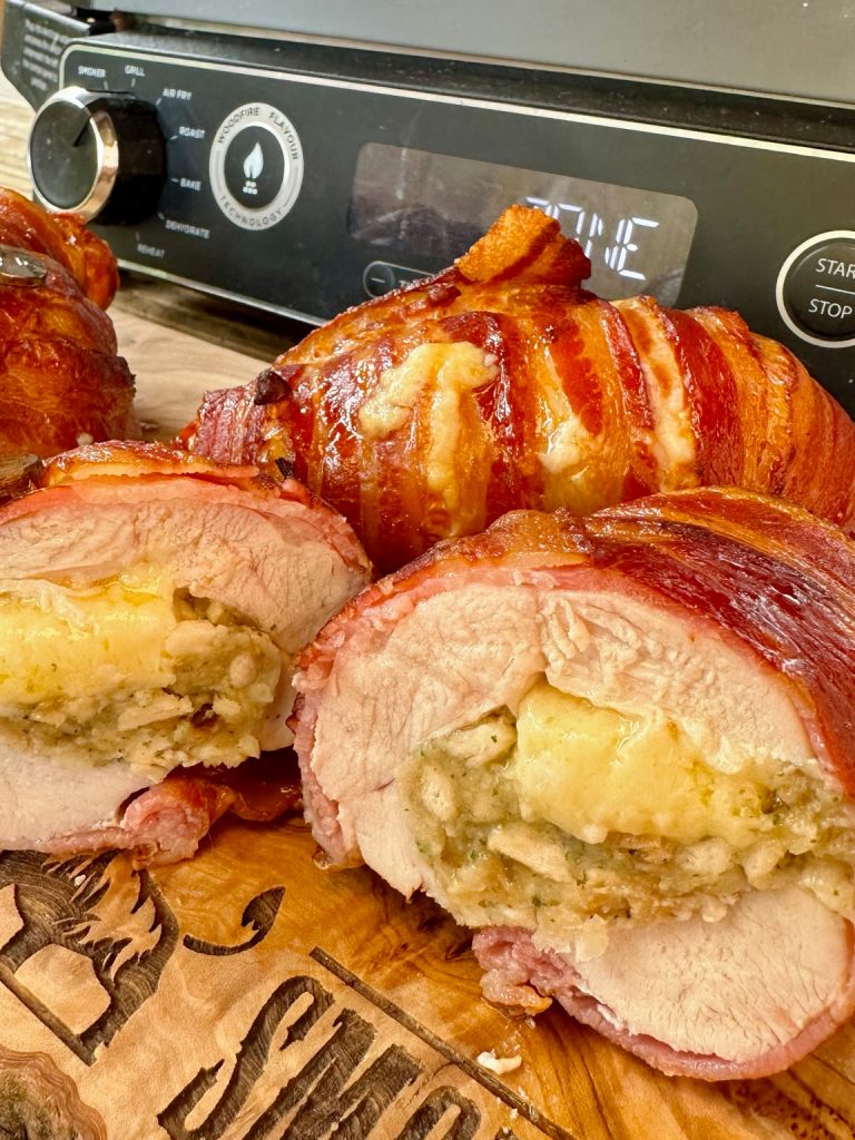 https://www.smokeandsear.world/wp-content/uploads/2023/07/Sage-Onion-and-Cheddar-Stuffed-Chicken-Bacon-on-the-Ninja-Woodfire-Grill-Photo-6-768x1024.jpg
