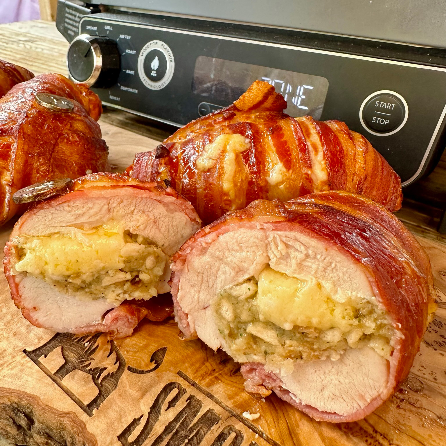 https://www.smokeandsear.world/wp-content/uploads/2023/07/Sage-Onion-and-Cheddar-Stuffed-Chicken-Bacon-on-the-Ninja-Woodfire-Grill-Photo-6.jpg