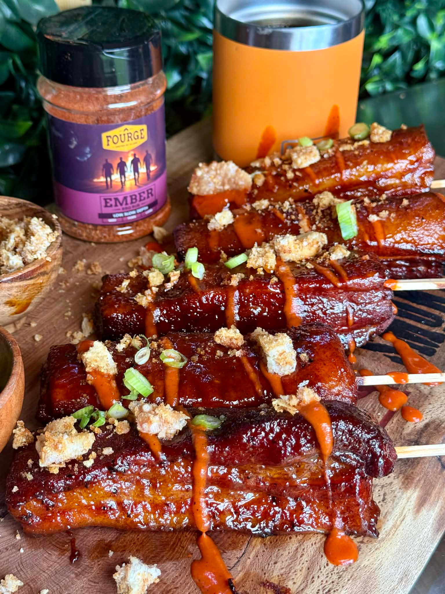 EMBER Pork Belly Lollipops with Bright Orange Pepper Drizzle & Crackling Crumb